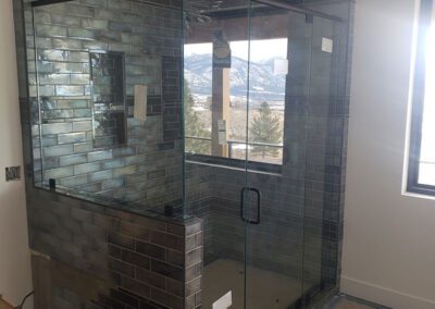 Dark shower with glass doors